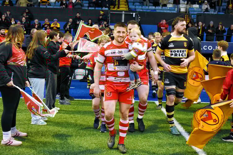 Llandovery captian Lee Rees leads his side on to the pitch