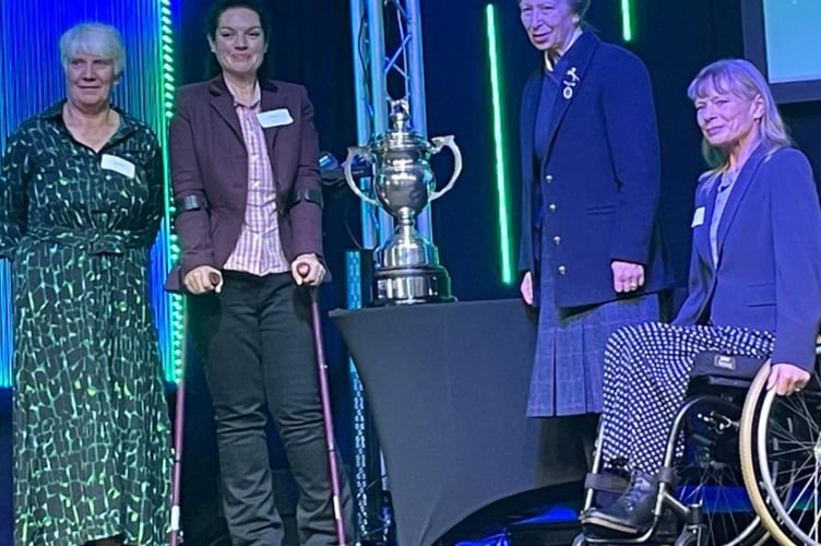 Brecon para carriage driver Emily Ham (second from left) and fellow driver Deborah Daniel (far right) receive the Birt Spooner Cup from Anne, Princess Royal at the Riding for the Disabled Association awards