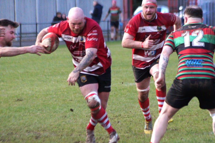 Darren Witcomb powers through for a try