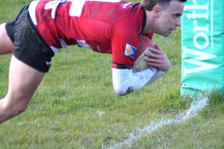 Geraint Workman scores Brecon's first try after a great break from Tom Richards