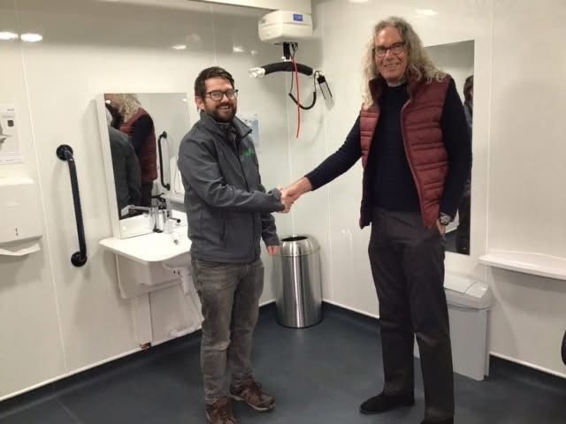 Cllr Steve Deeks-D’Silva receives the keys to the newly refurbished Station Crescent toilets from Tom of Danfo UK Ltd