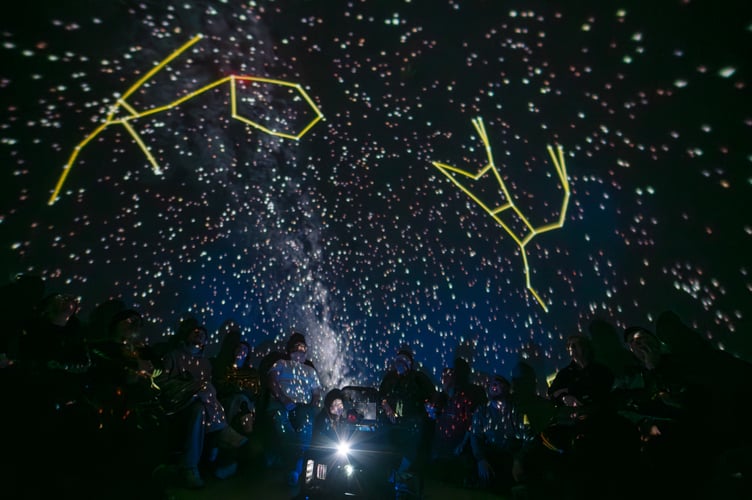 Attendees enjoying a planetarium event