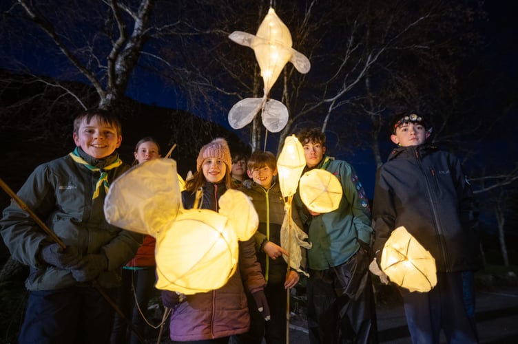 Festival-goers parade beneath Caban Coch Dam at the first Elan Dark Sky Festival