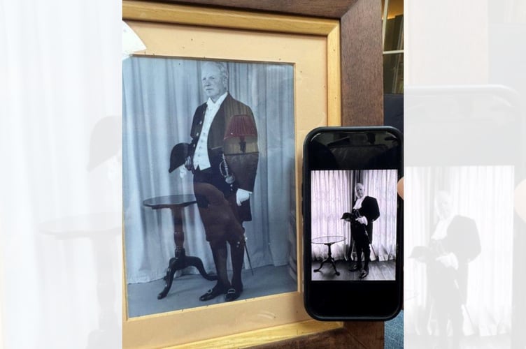 William Watkins, the High Sheriff of Powys, with a photograph of his grandfather Jack Watkins MBE, who served as High Sheriff of Radnorshire in 1956