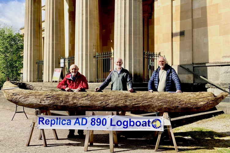 Mervyn Bramley, Roger Reese and Bob Hansel (great-nephew of Thomas Jenkins) with the replica log boat outside y Gaer in Brecon