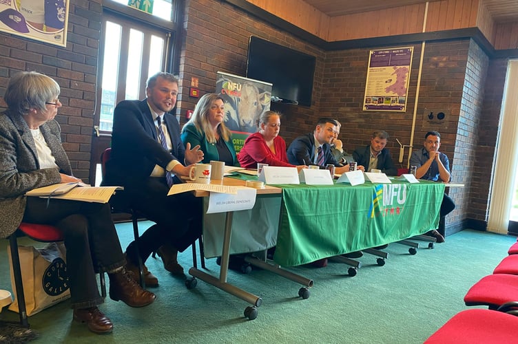 Senedd election candidates speaking with farmers during a hustings event at the YFC Cymru Centre, Royal Welsh Showground, Llanelwedd