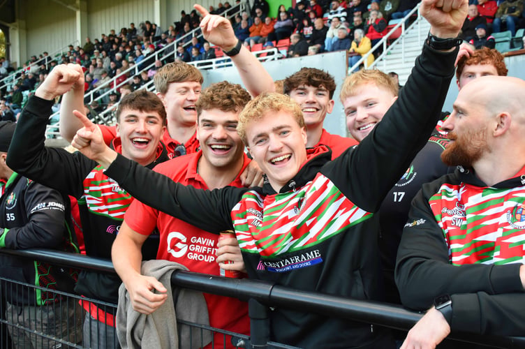 Llandovery squad members celebrate another historic win