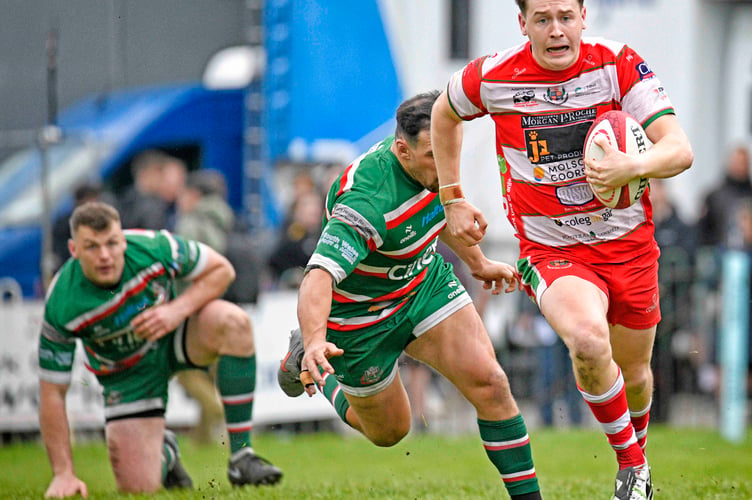 Kian Abraham makes a break for Llandovery