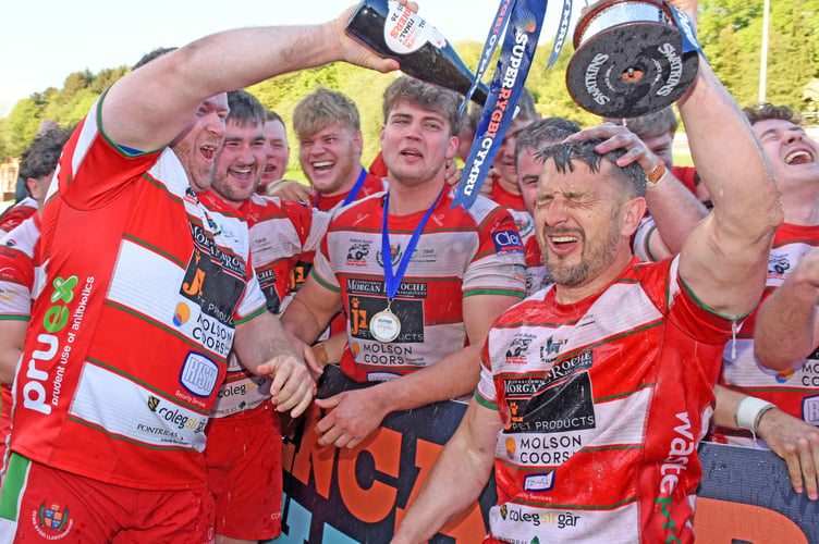 Players celebrate with captain Lee Rees