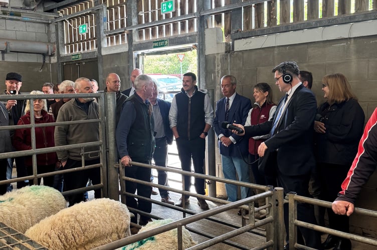 Reform UK leader Nigel Farage during a visit to Brecon Livestock Market