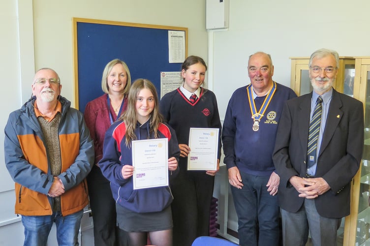Left to right: Rotarian Ciaran O’Connell, Head of English Anwen Nicholls, Martha Jones, Matilda Batten, Rotary President Hugh Garner, and Rotarian Arthur Harries