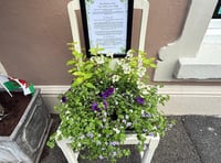 Old chairs turned into art in business trail