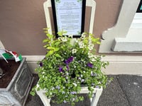 Old chairs turned into art in business trail