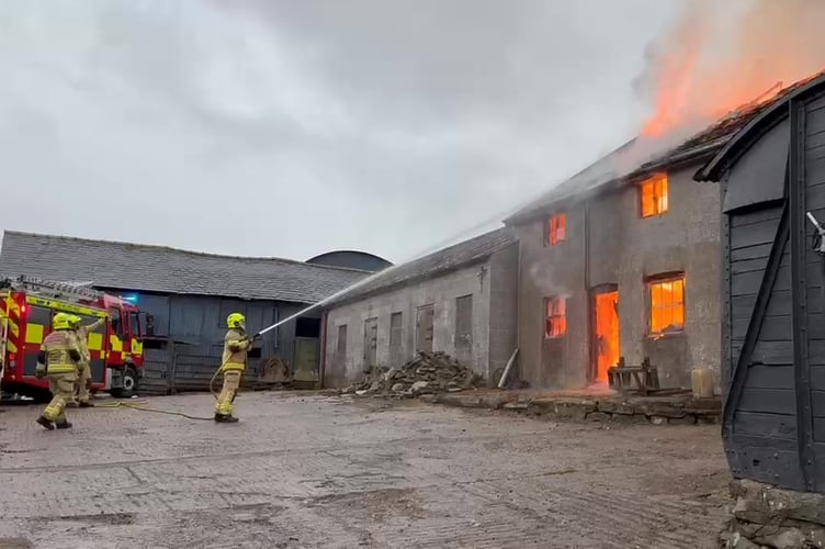 Firefighters from across Mid Wales tackled a large fire at a farm building in Llanidloes