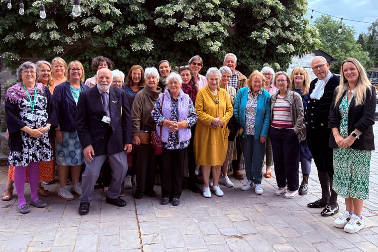 Volunteers and guests gather at a special afternoon tea hosted by the High Sheriff of Powys