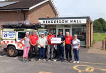 Rescue team receive £2,400 cheque from Royal Marine Band Concert