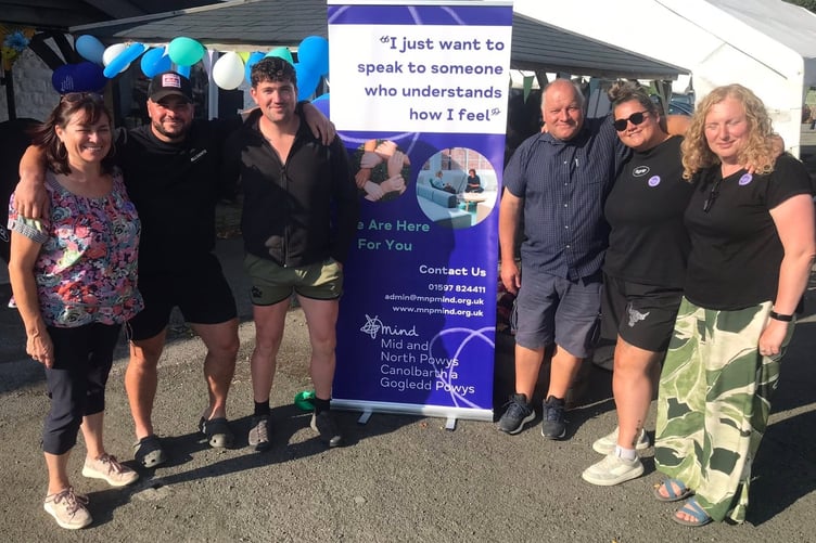Community support – supporting Mid and North Powys Mind. Left to right: Jessica Weale, Toby Weale, a family friend (who does not wish to be named), Martin Weale, Maddy Weale, and Mary Griffiths, Development Manager and co-CEO of Mid and North Powys Mind