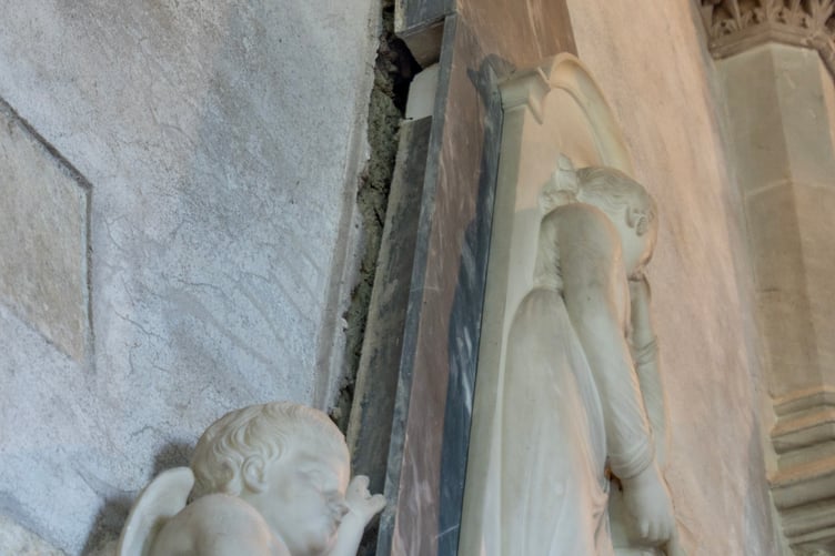 The 18th-century marble Lewis Monument to Ann Lewis inside the church