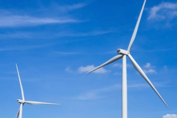 Councillors have called for a pause on major windfarm developments while Wales reviews its energy strategy.