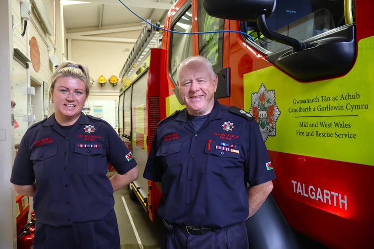 Watch Manager Bryan Davies and Firefighter Katrina Davies have clocked up more than 64 years of combined service with Mid and West Wales Fire and Rescue Service