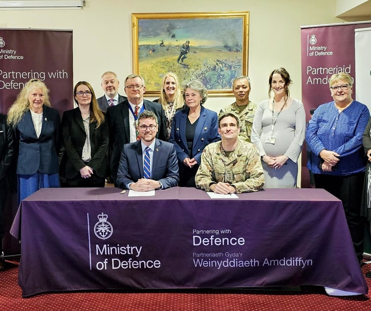 Cllr Matthew Dorrance signing the Armed Forces Covenant