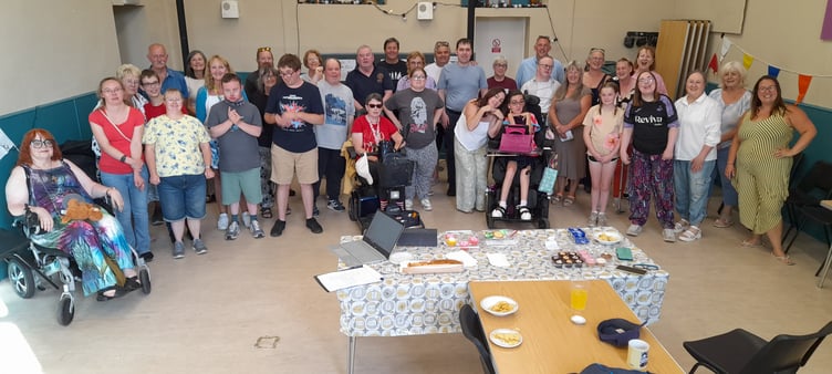 Members of Westenders and Theatr Wildcats celebrate their new partnership at a tea and cake party at Westenders Hall