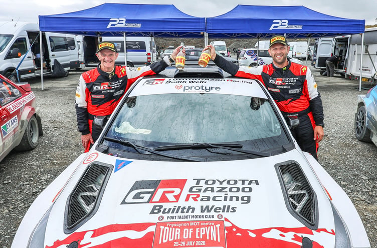Jason Pritchard and Phil Clarke celebrate their Tour of Epynt Rally victory alongside their Toyota GR Yaris Rally2