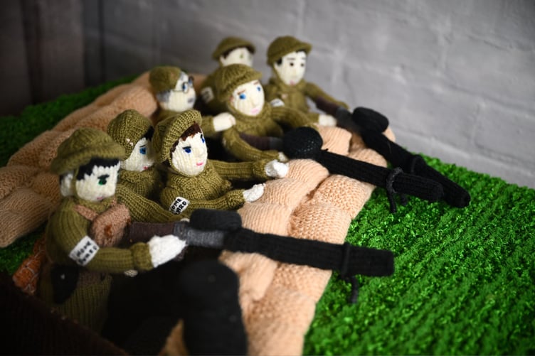 The knitted exhibition brings wartime stories to life through detailed handmade scenes