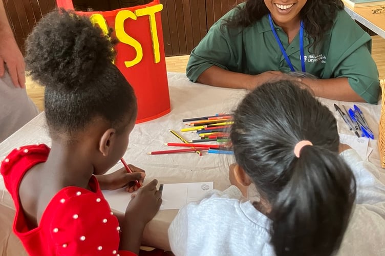 Tamara Mascarenhas, Community Development Officer at Bannau Brycheiniog National Park Authority, with two young visitors