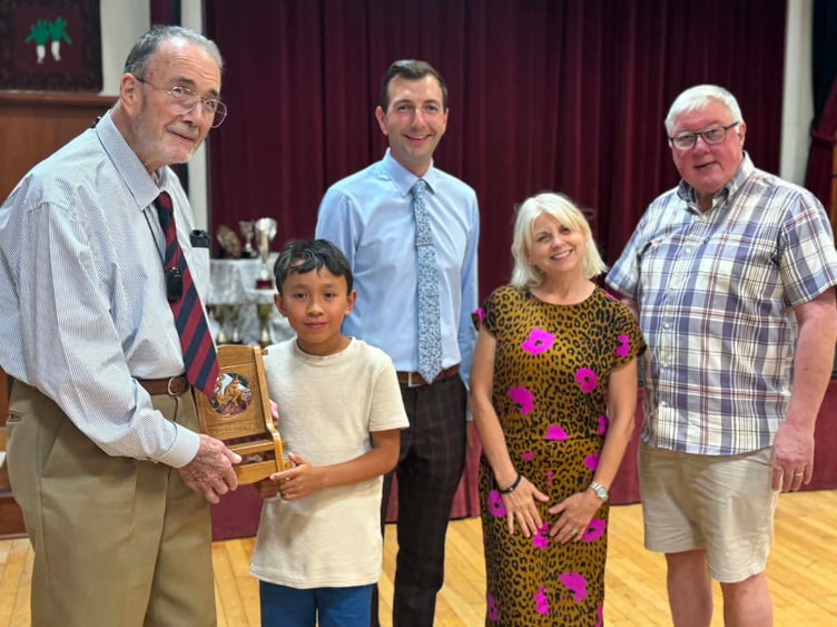 Psalm Payne receives the chair for showing the most potential from Alec Tompkins, who made the award, alongside afternoon president Marc Williams and adjudicators Gareth Wyn Thomas and Elen Rhys