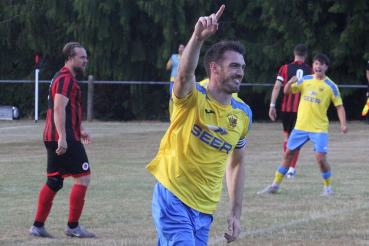 Dale Evans celebrates pulling a goal back for Brecon Corries