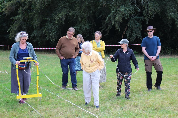 Archaeologist Jennifer Muller demonstrated the use of the earth resistance meter
