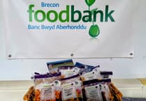 New Brecon store makes generous foodbank donation