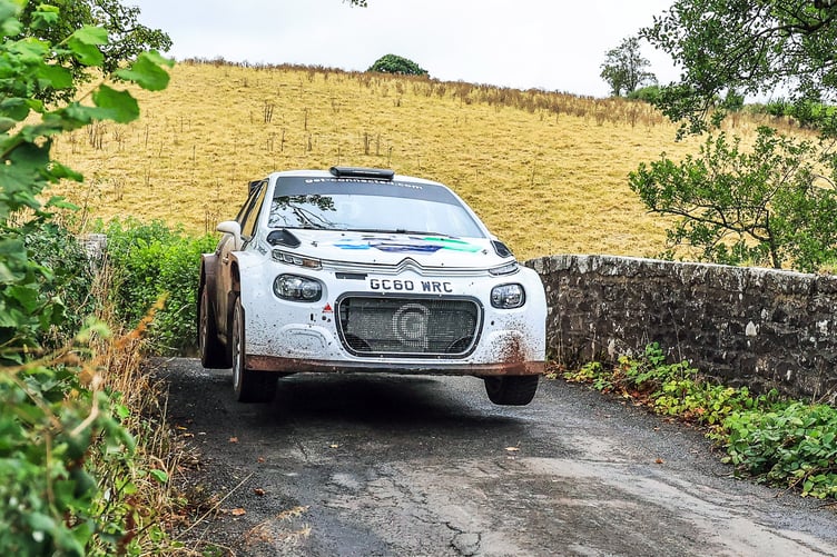 Event sponsor Damian Cole and Ian Allsop leap over ‘Sycamore Bridge’ near Merthyr Cynog on their way to third position