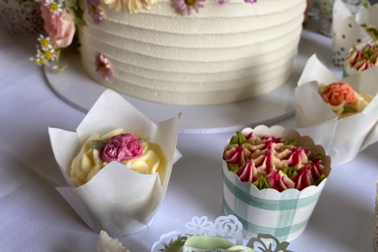 The wedding cake and cupcakes helped make the couple’s dream day complete