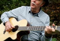 Guitarist, vocalist, raconteur's live performance in a Brecon church