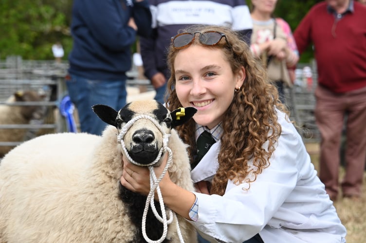 Young handler Evie Lewis displaying her sheep