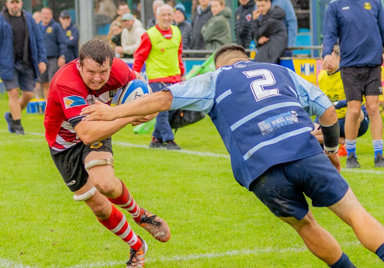Matthew Williams on his way to finishing a fine move to score Brecon’s fourth try