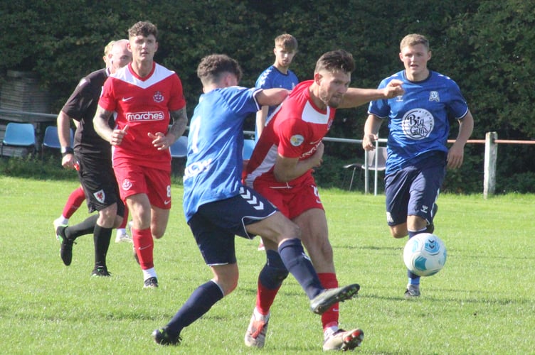 Knighton Town and FC Queens Park in action