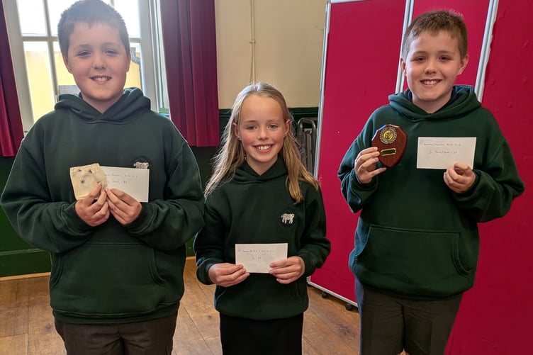 Gracie Jones with Sion and Huw Elias and their prizes