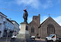 Traffic cone on top of Duke of Wellington monument in town