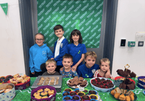 Year 6 and nursery children team up for coffee and cake afternoon
