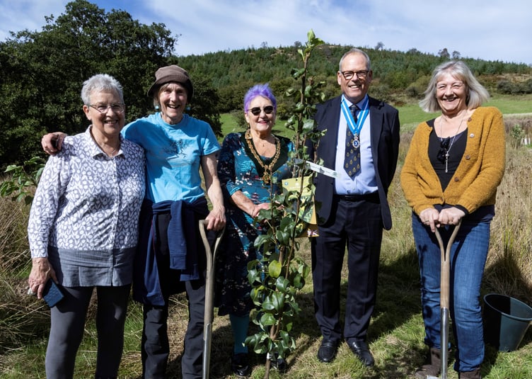 Williams Watkins, High Sheriff of Powys, with the team behind Llanwrtyd Community Orchard at its official opening at Lofftwen