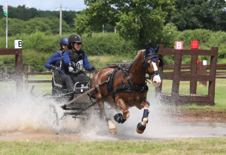 Emily Ham and Alfie tackle a water obstacle at Chepstow