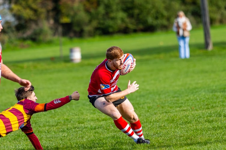 Jack Davis breaks through the Tata Steel defence and comes close to setting up a brilliant try for Brecon