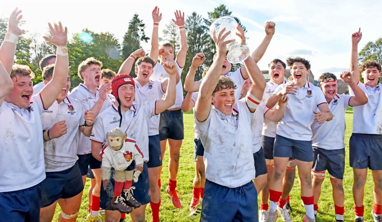 Llandovery College celebrate their victory by lifting the trophy after beating Christ College 41-10