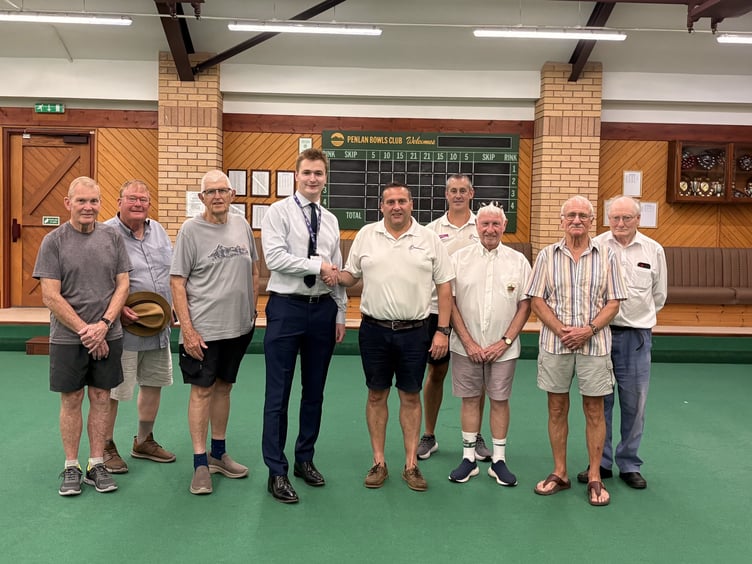 Cllr Raiff Devlin with Freedom Leisure General Manager Richard Gealy and members of Penlan Indoor Bowling Club at Brecon Leisure Centre